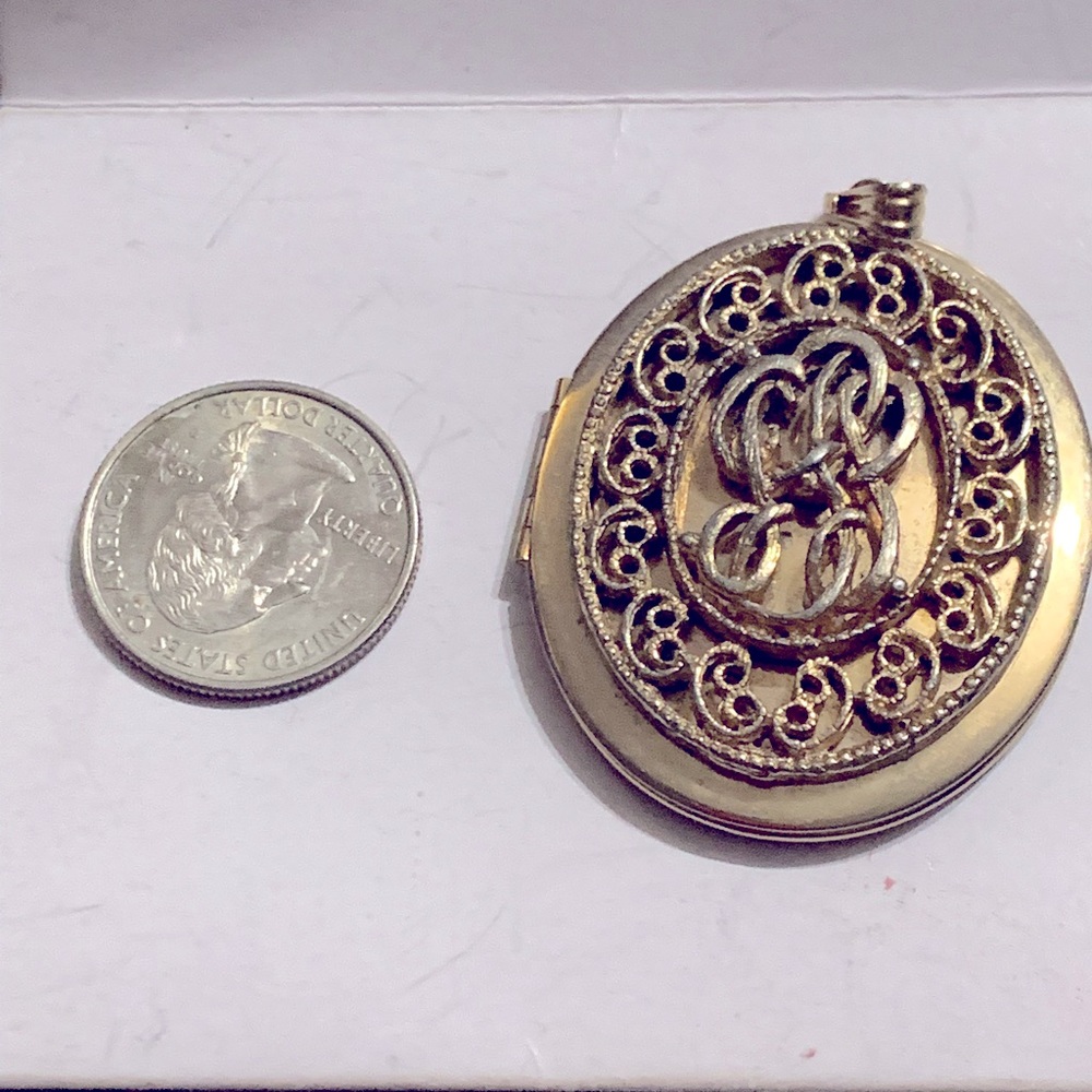 Large gold tone locket pendant